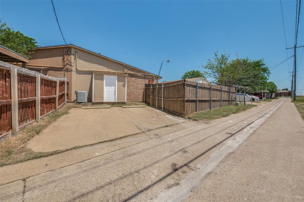 7305 Pineberry Road Dallas, TX 75249 - Photo 25 of 25 a view of a house with a outdoor space