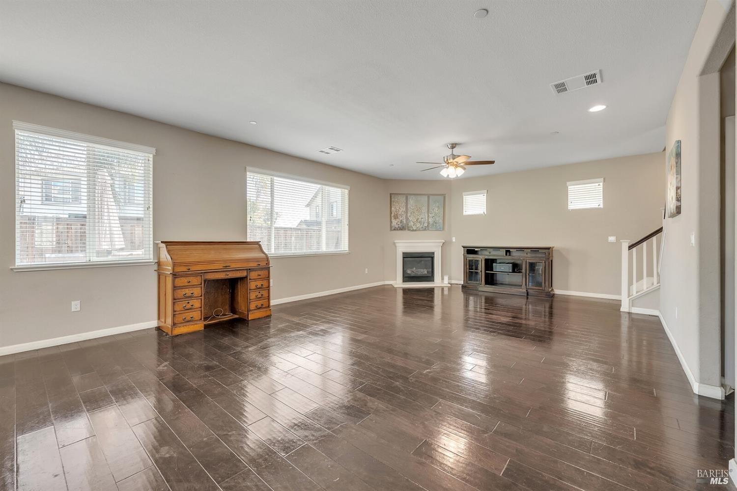 526 Epic Street Vacaville, CA 95688 - Photo 12 of 39 a view of empty room with wooden floor and fireplace