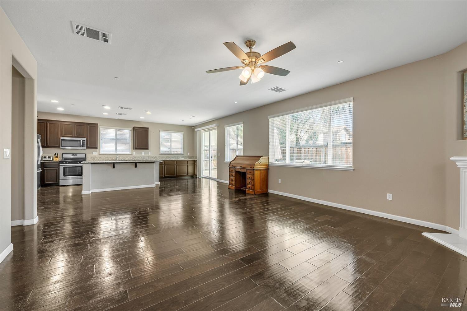 526 Epic Street Vacaville, CA 95688 - Photo 15 of 39 a view of a living room and kitchen with hardwood floor