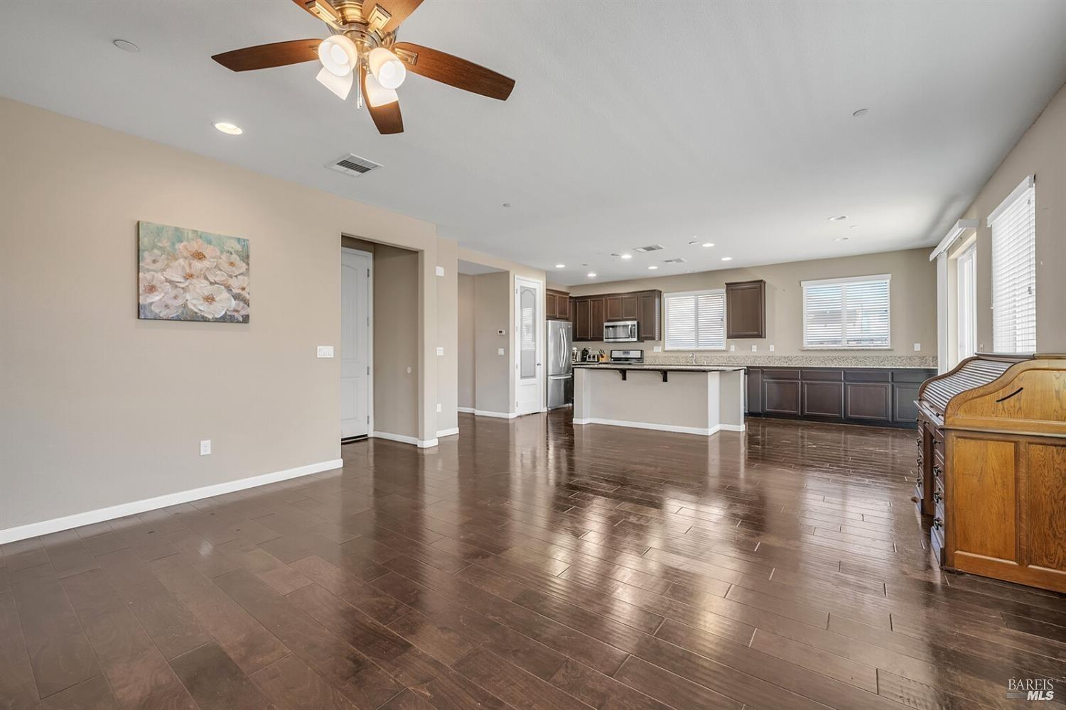 526 Epic Street Vacaville, CA 95688 - Photo 16 of 39 a view of a livingroom with furniture a ceiling fan and wooden floor