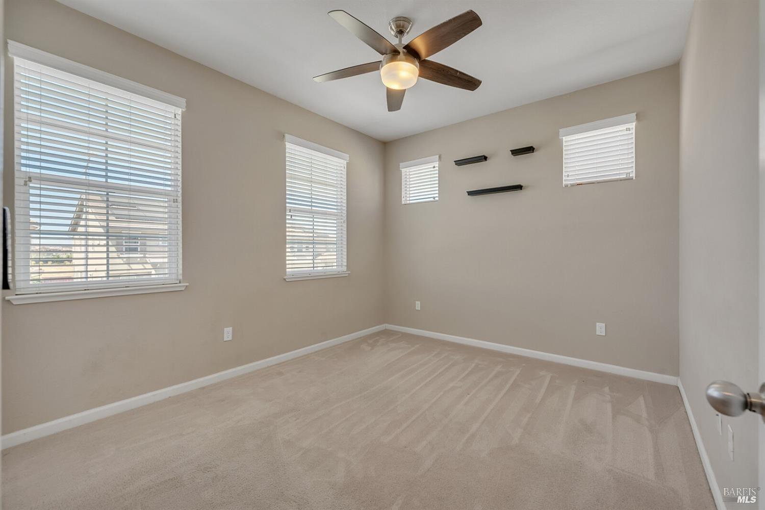 526 Epic Street Vacaville, CA 95688 - Photo 19 of 39 a view of room with a ceiling fan and window