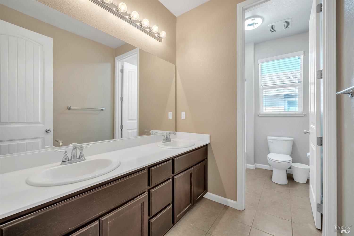 526 Epic Street Vacaville, CA 95688 - Photo 22 of 39 a bathroom with a sink and a mirror