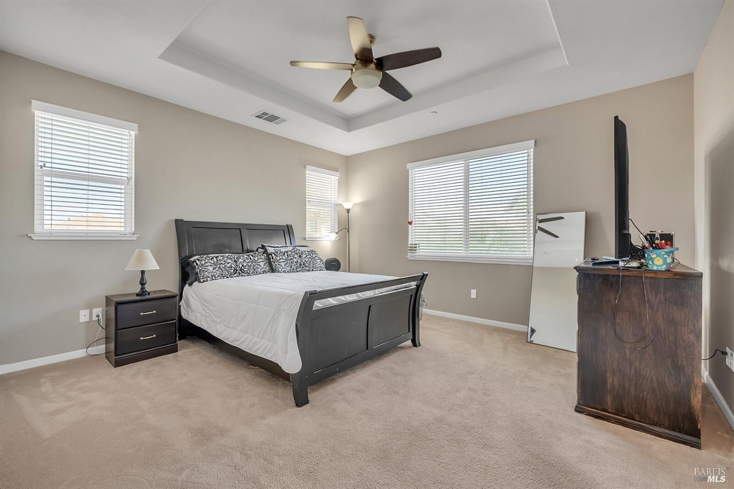 526 Epic Street Vacaville, CA 95688 - Photo 23 of 39 a bedroom with a bed and a flat screen tv