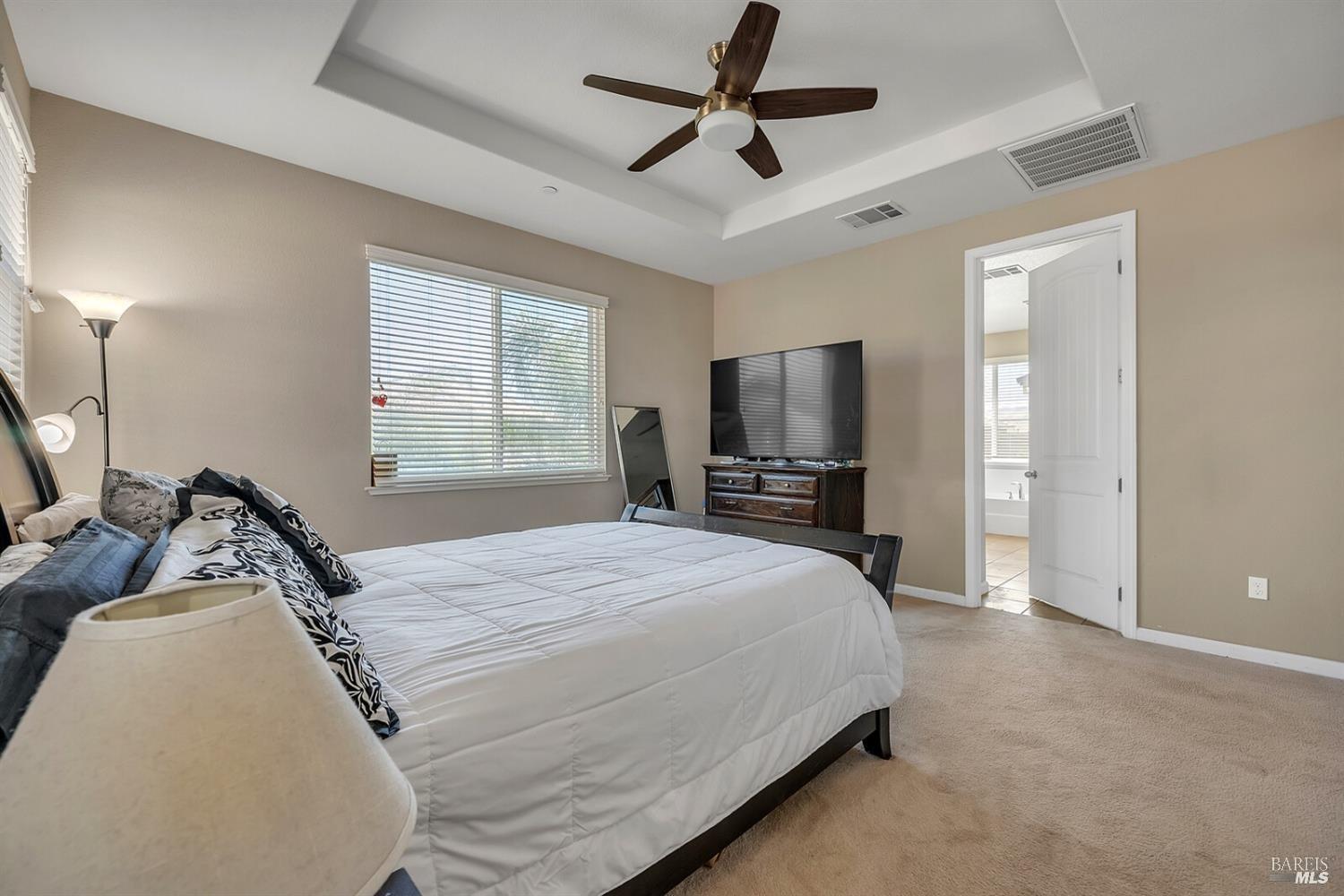 526 Epic Street Vacaville, CA 95688 - Photo 24 of 39 a bedroom with a bed and a flat screen tv