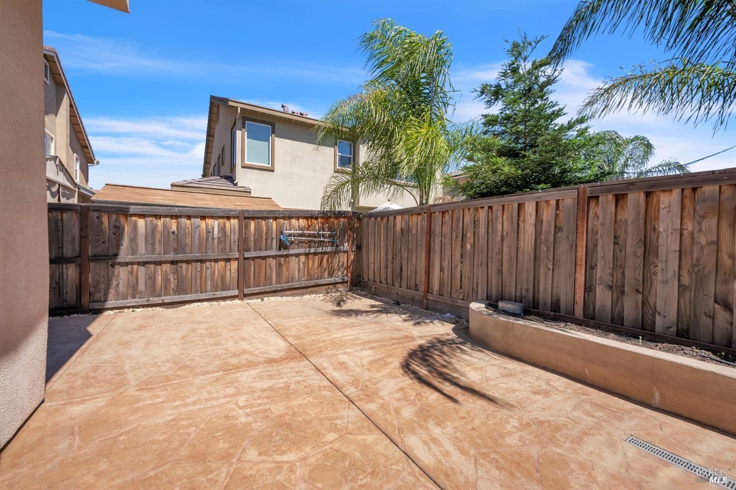 526 Epic Street Vacaville, CA 95688 - Photo 36 of 39 a view of backyard with wooden fence and trees