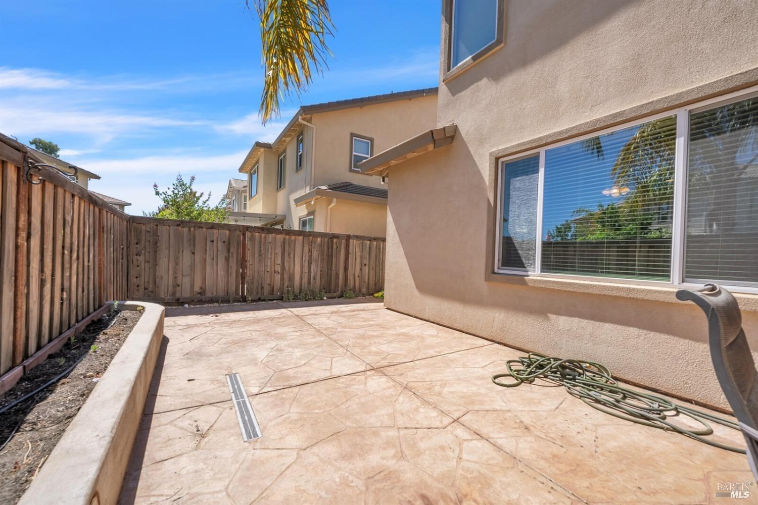 526 Epic Street Vacaville, CA 95688 - Photo 37 of 39 a view of backyard with wooden fence and large trees
