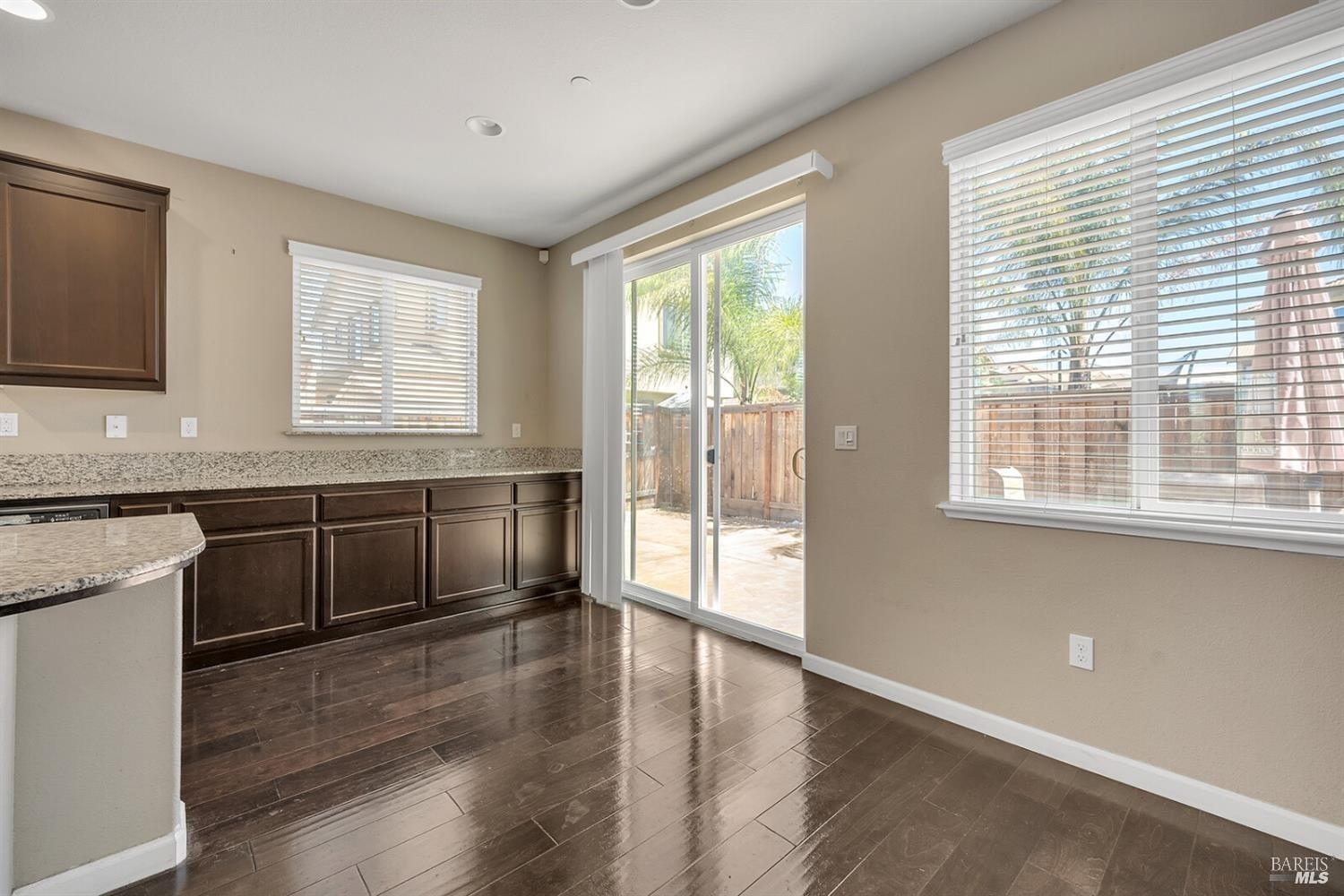 526 Epic Street Vacaville, CA 95688 - Photo 9 of 39 a kitchen with stainless steel appliances granite countertop a stove a sink and a granite counter tops with a large window