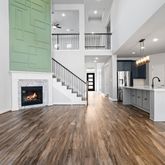 a view of a kitchen with cabinets and wooden floor