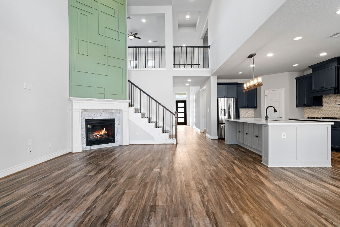 a view of a kitchen with cabinets and wooden floor