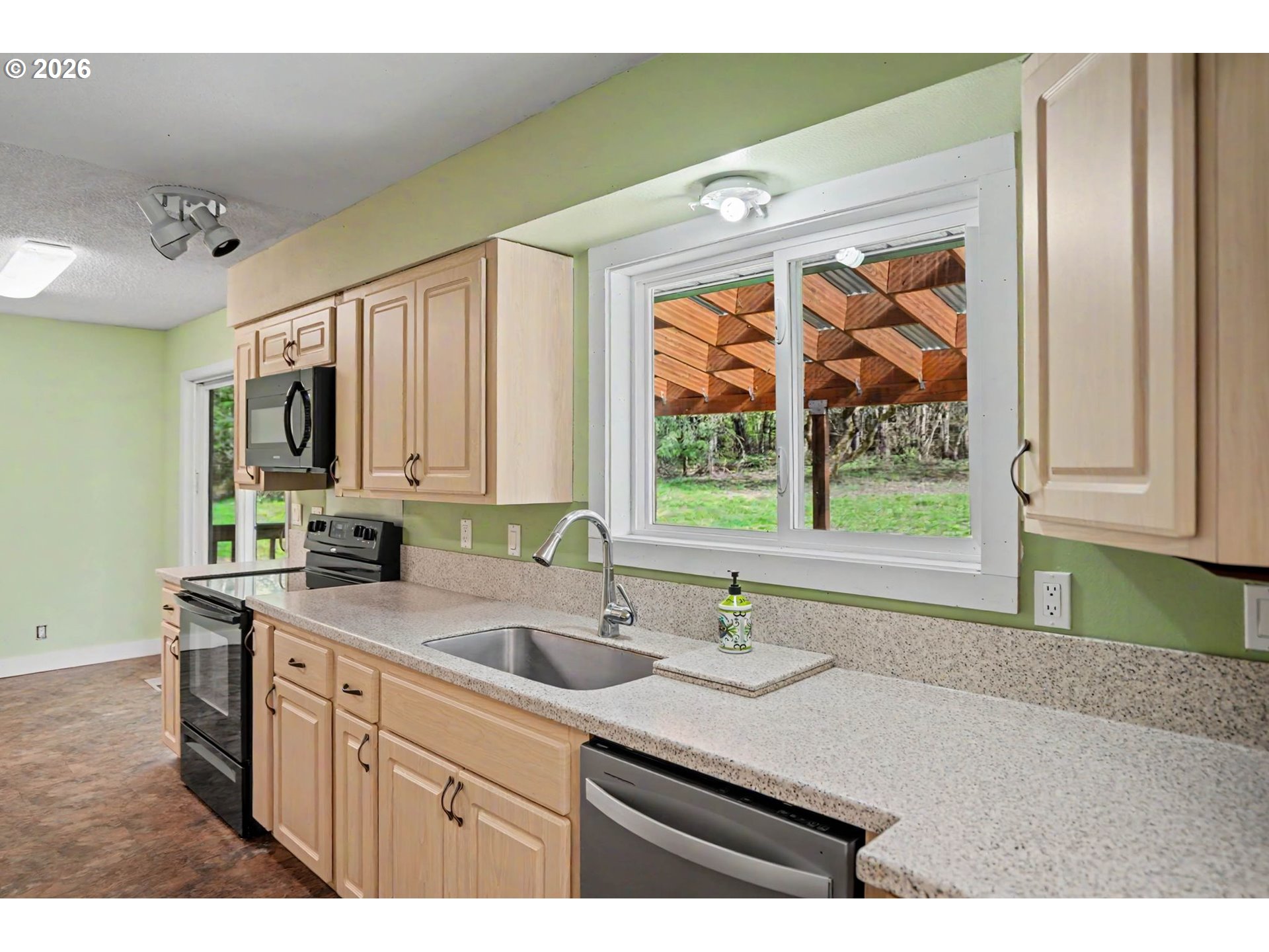11072 South Bremer Road Canby, OR 97013 - Photo 14 of 44 a kitchen with a sink cabinets and a large window