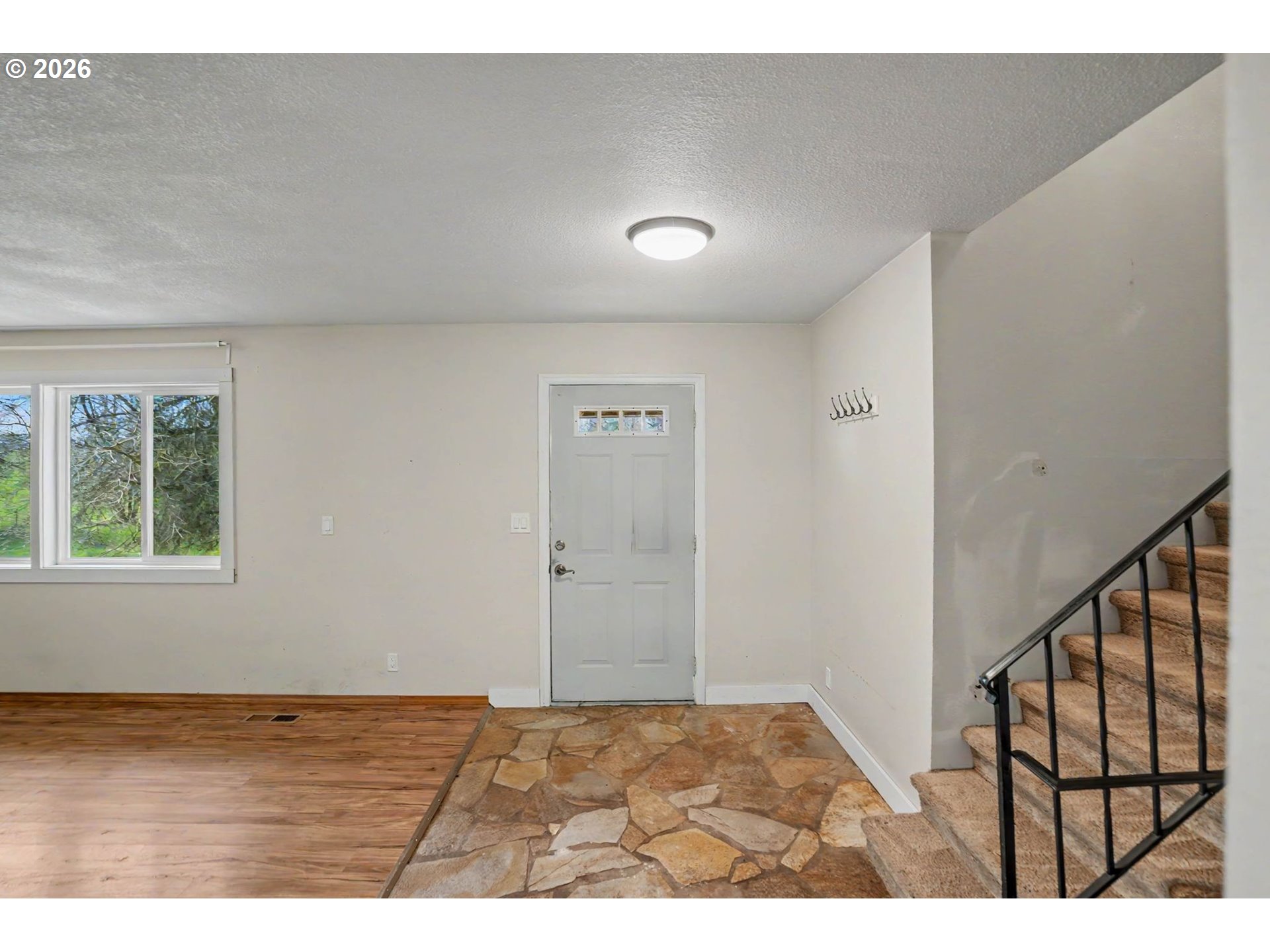 11072 South Bremer Road Canby, OR 97013 - Photo 16 of 44 a view of an empty room with wooden floor and windows