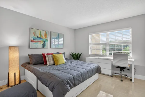 a living room with a bed and furniture
