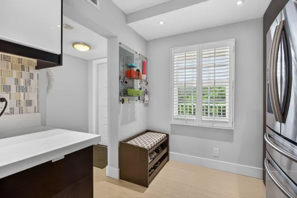 a bathroom with a sink a vanity and a window