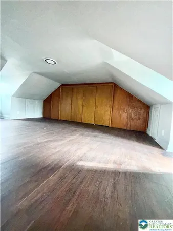an empty room with wooden floor