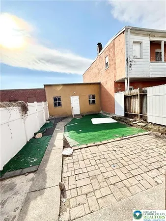 a view of a back yard of the house