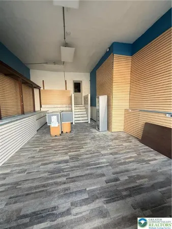 a room with a bed and window