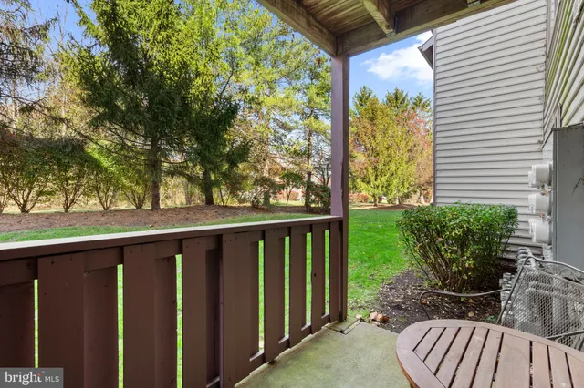 a view of balcony with furniture and garden