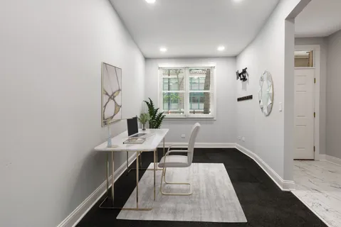 a workspace with furniture and window
