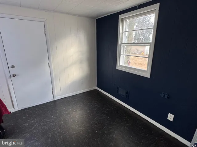 a view of a house with a snow on the road