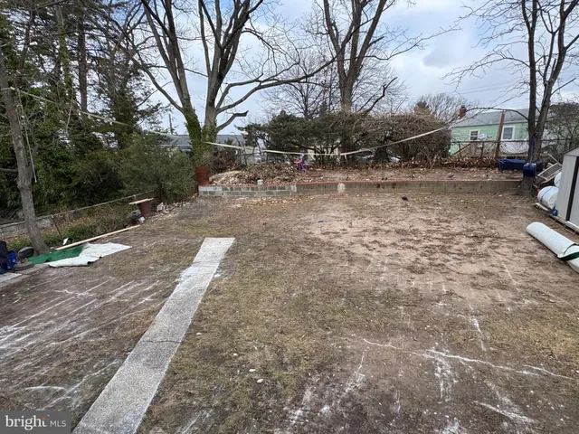 a small house with a trees in front of it