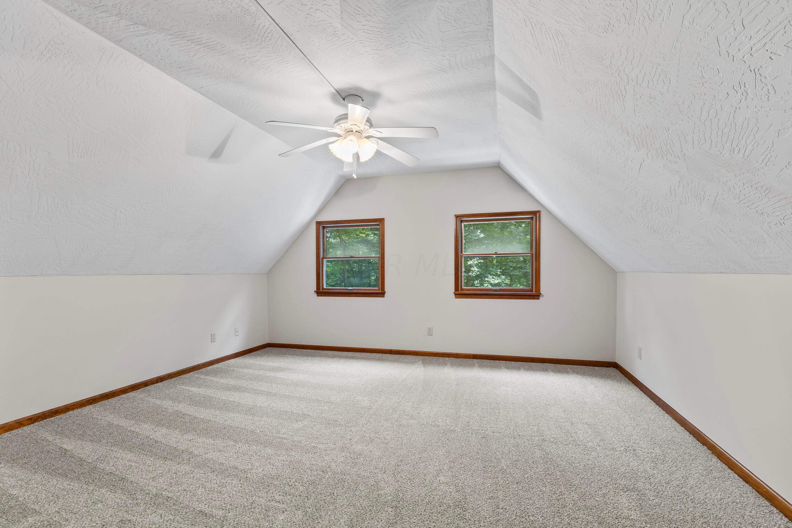 6940 Graham Road Mount Vernon, OH 43050 - Photo 35 of 70 • New light sand carpet
~ 06/2024
• Ivory painted walls
• Angled ceiling
• Lighted ceiling fan