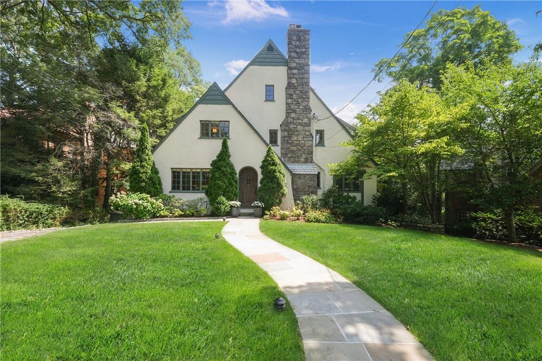 4 Ridgecrest East Scarsdale, NY 10583 - Photo 1 of 1 a view of a white house next to a yard with big trees