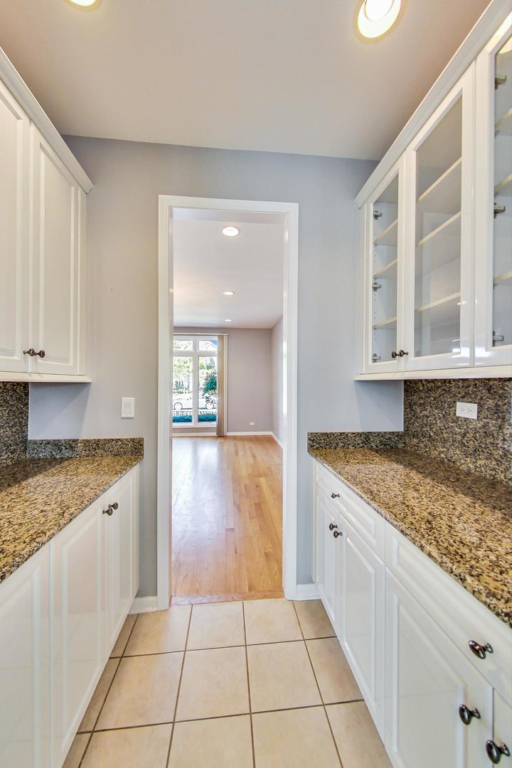 36 Riverside Drive Deerfield, IL 60015 - Photo 12 of 42 a kitchen with a sink a stove and cabinets