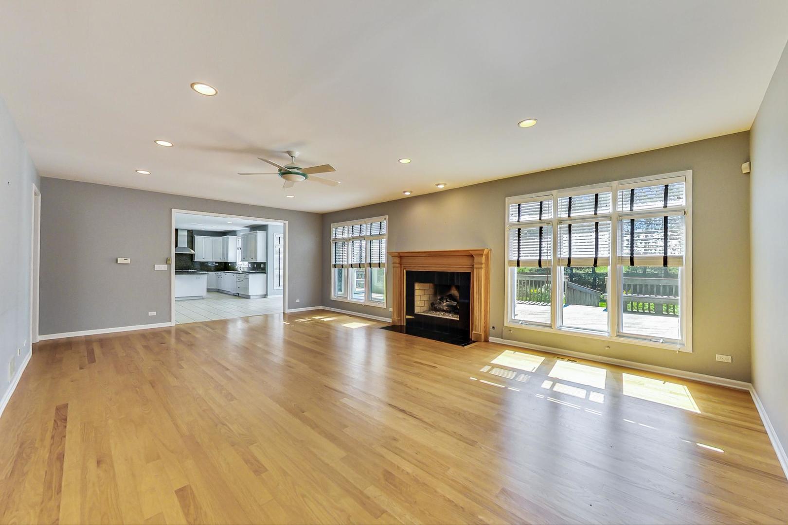 36 Riverside Drive Deerfield, IL 60015 - Photo 13 of 42 a view of empty room with fireplace and wooden floor