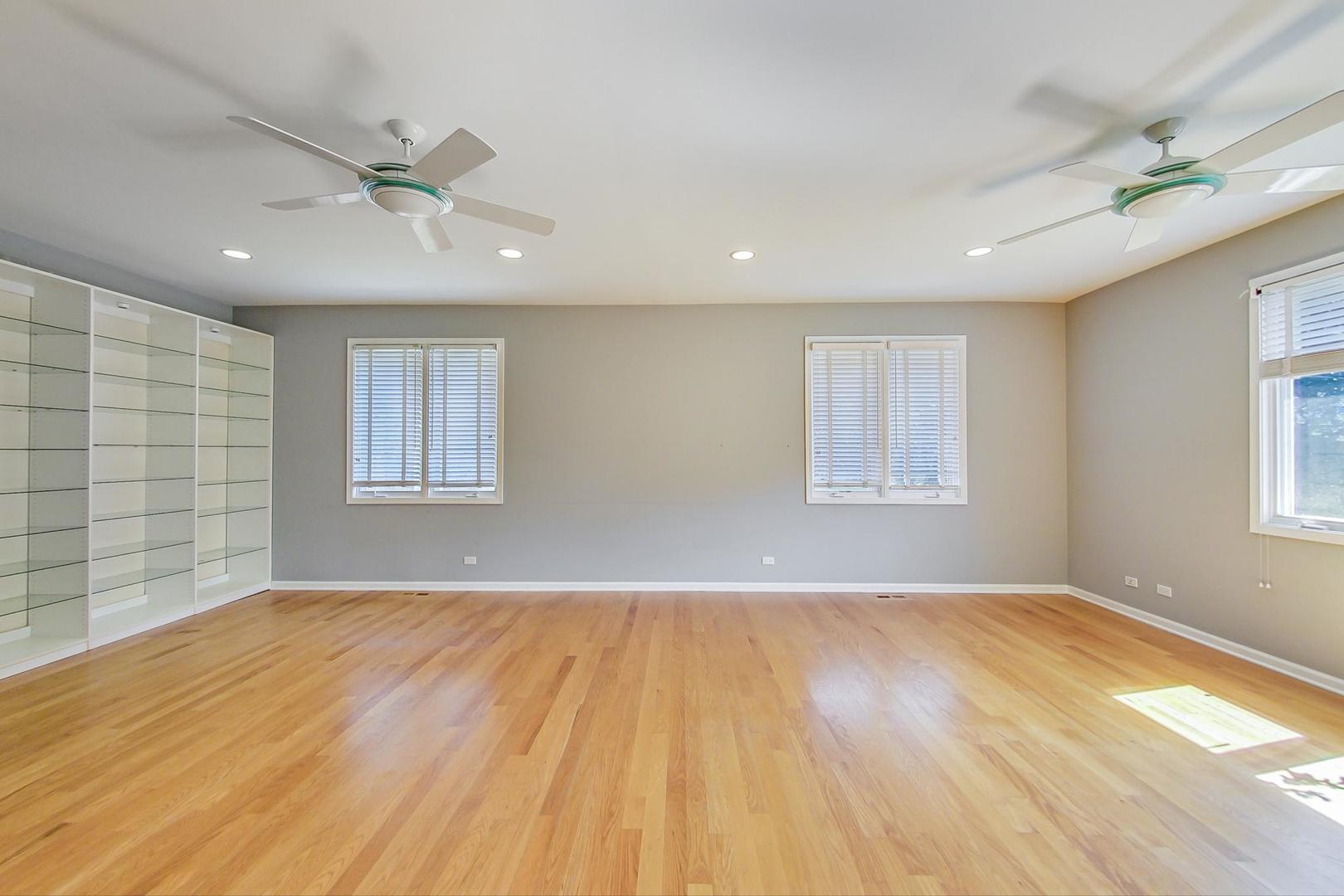 36 Riverside Drive Deerfield, IL 60015 - Photo 15 of 42 a view of empty room with wooden floor and fan