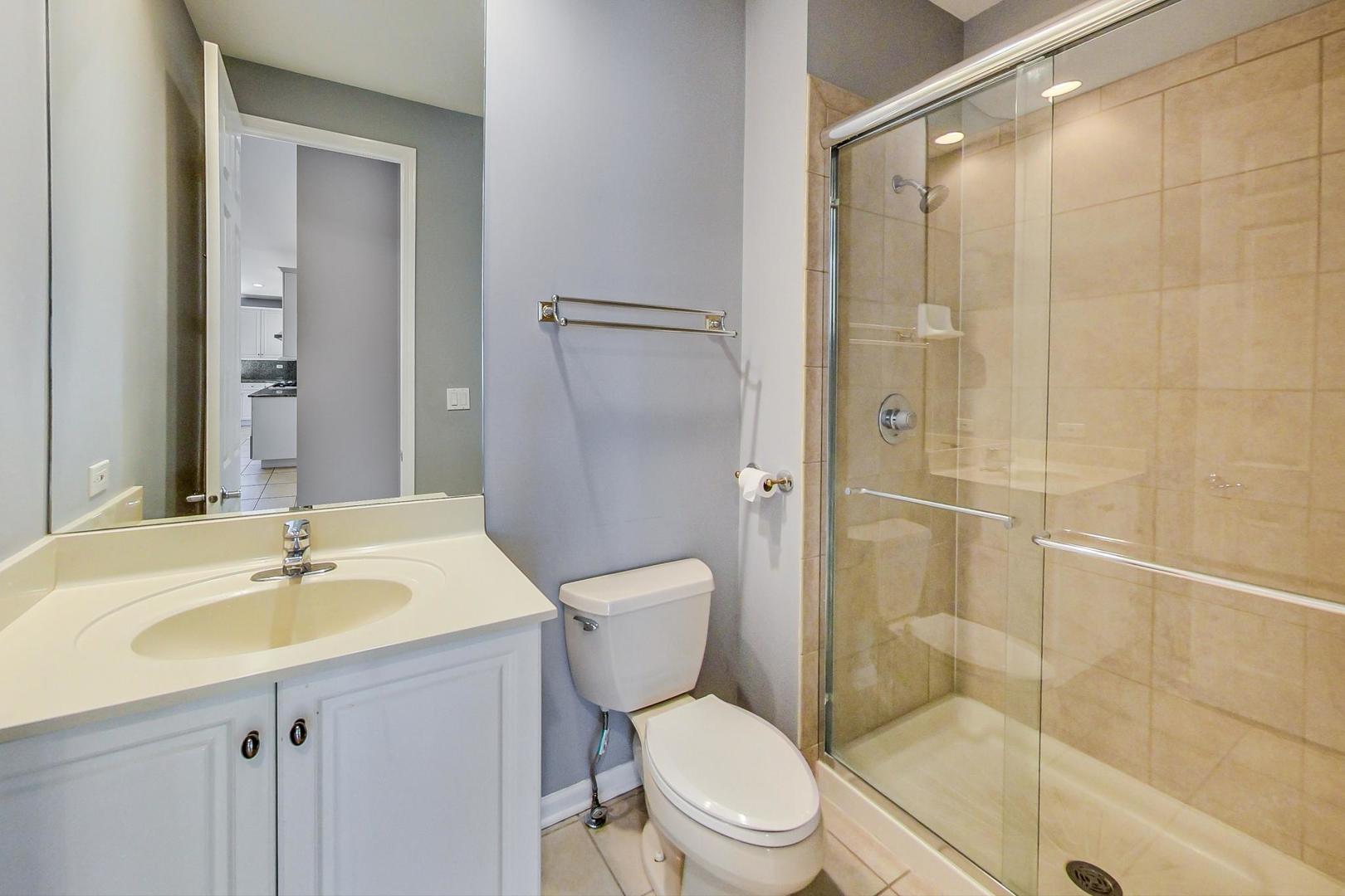36 Riverside Drive Deerfield, IL 60015 - Photo 20 of 42 a bathroom with a sink toilet and shower