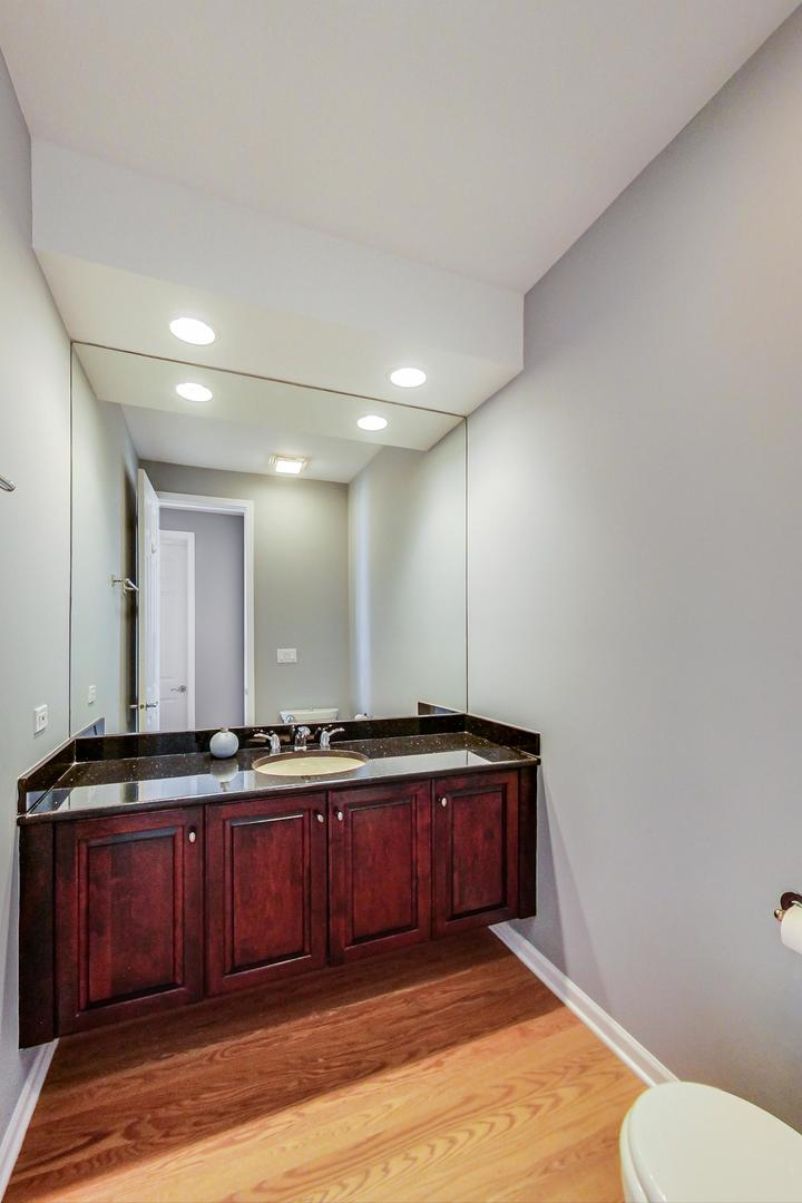 36 Riverside Drive Deerfield, IL 60015 - Photo 22 of 42 a bathroom with a sink and a mirror