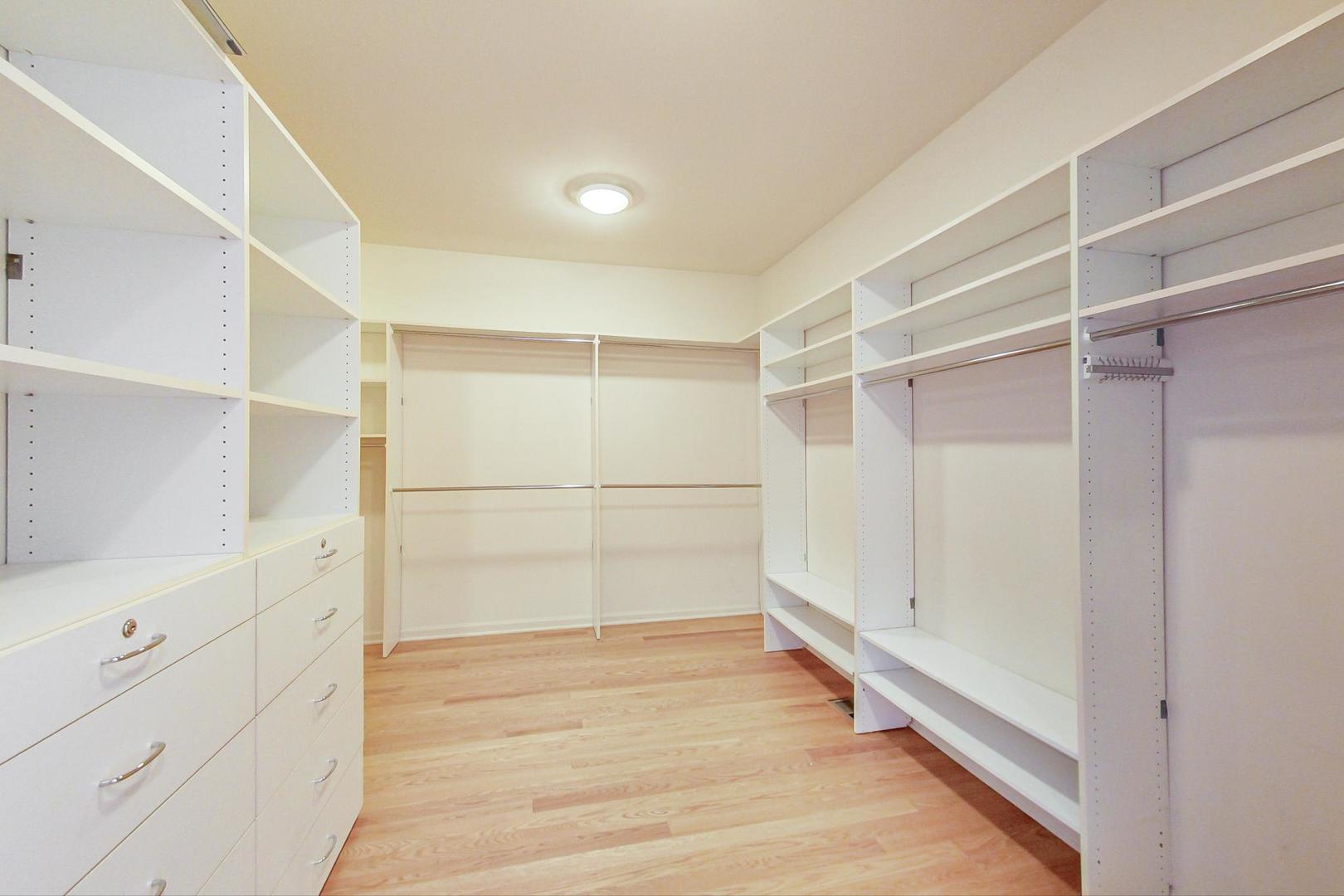 36 Riverside Drive Deerfield, IL 60015 - Photo 27 of 42 a view of walk in closet with empty racks