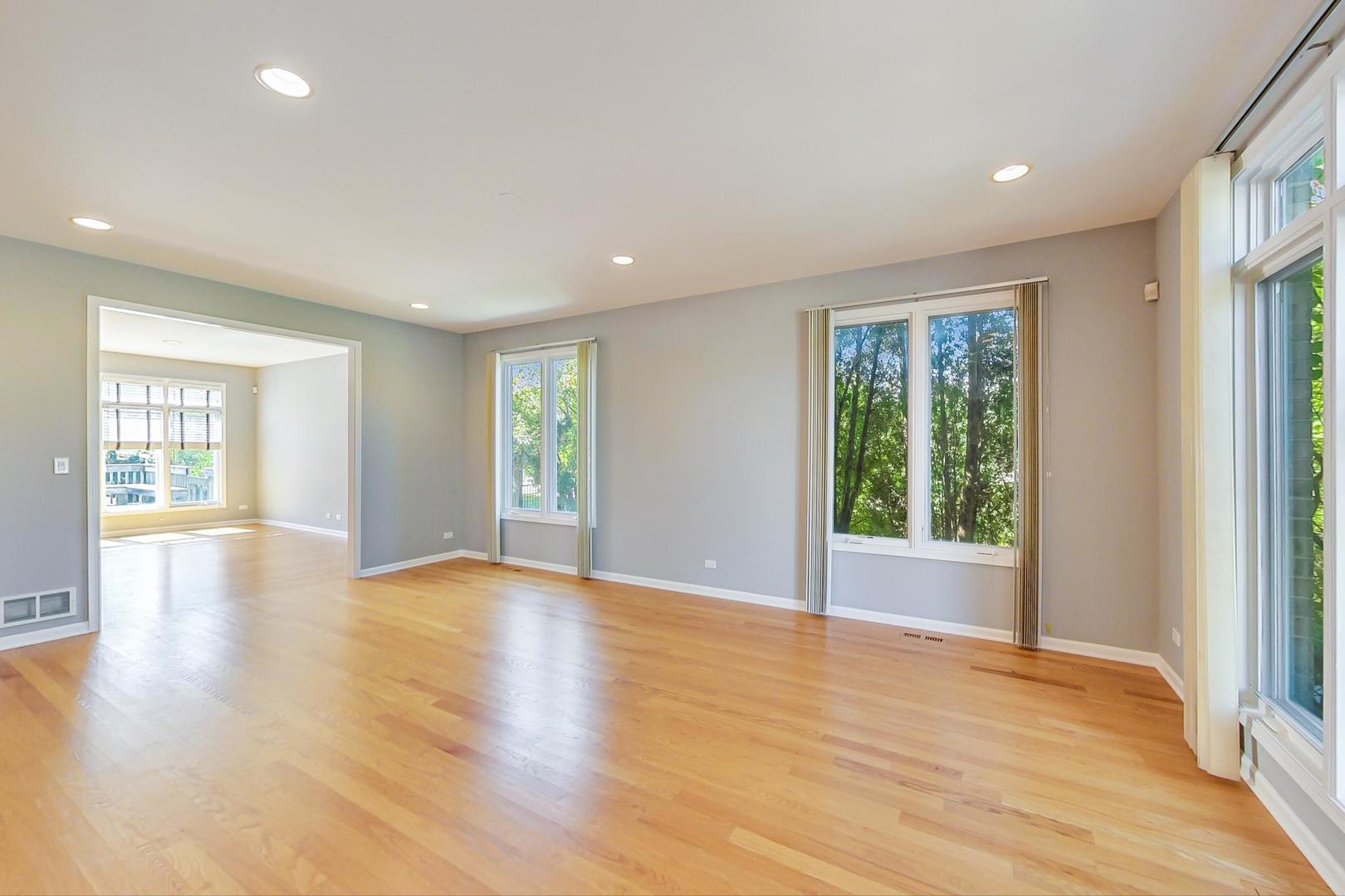 36 Riverside Drive Deerfield, IL 60015 - Photo 4 of 42 an empty room with wooden floor and windows