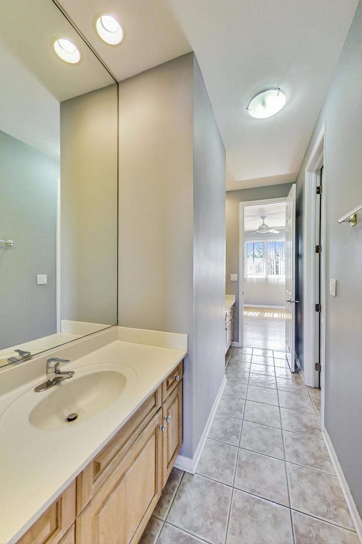 36 Riverside Drive Deerfield, IL 60015 - Photo 31 of 42 a bathroom with a sink and a mirror