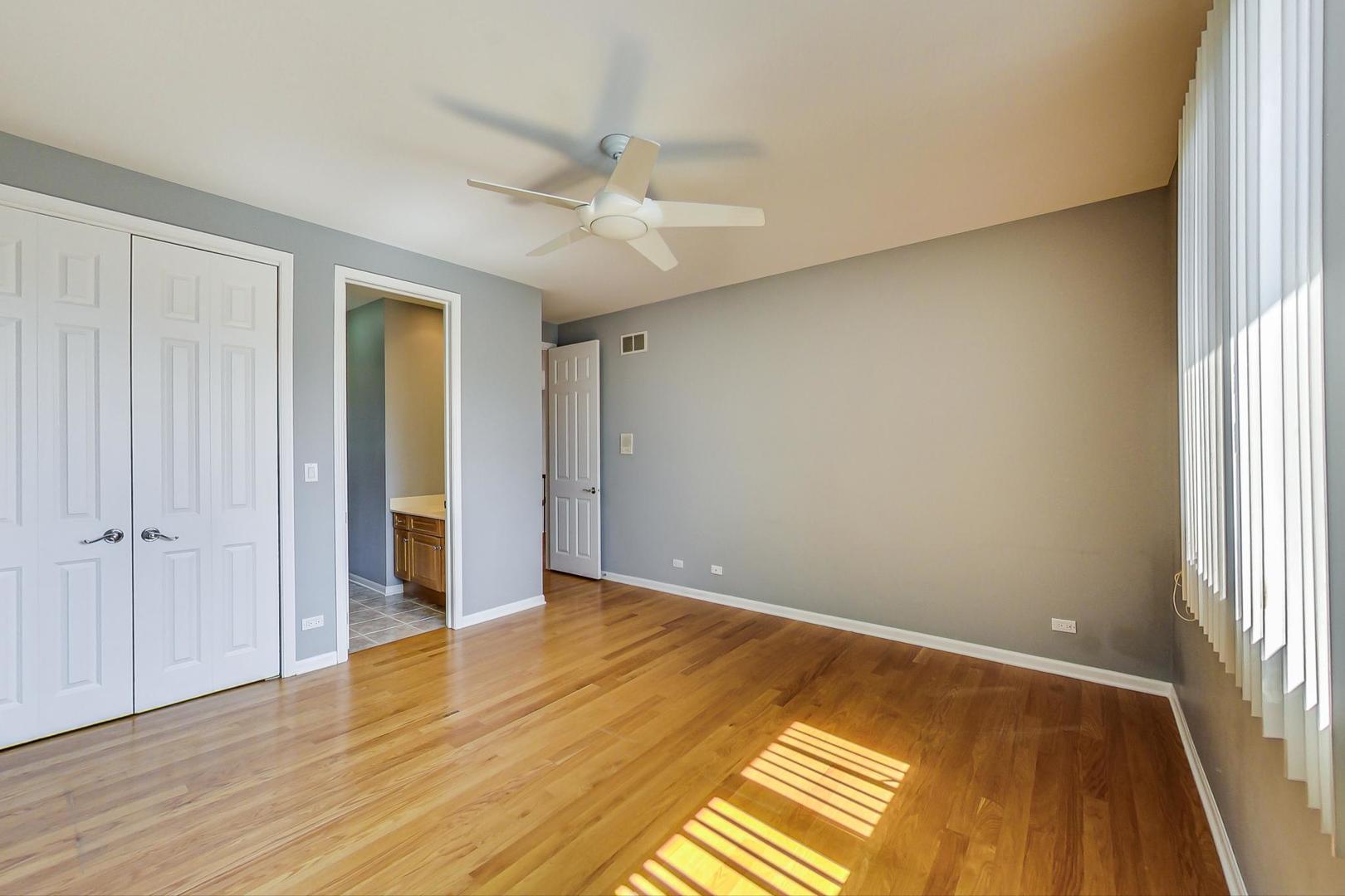 36 Riverside Drive Deerfield, IL 60015 - Photo 33 of 42 a view of an empty room with wooden floor and a window
