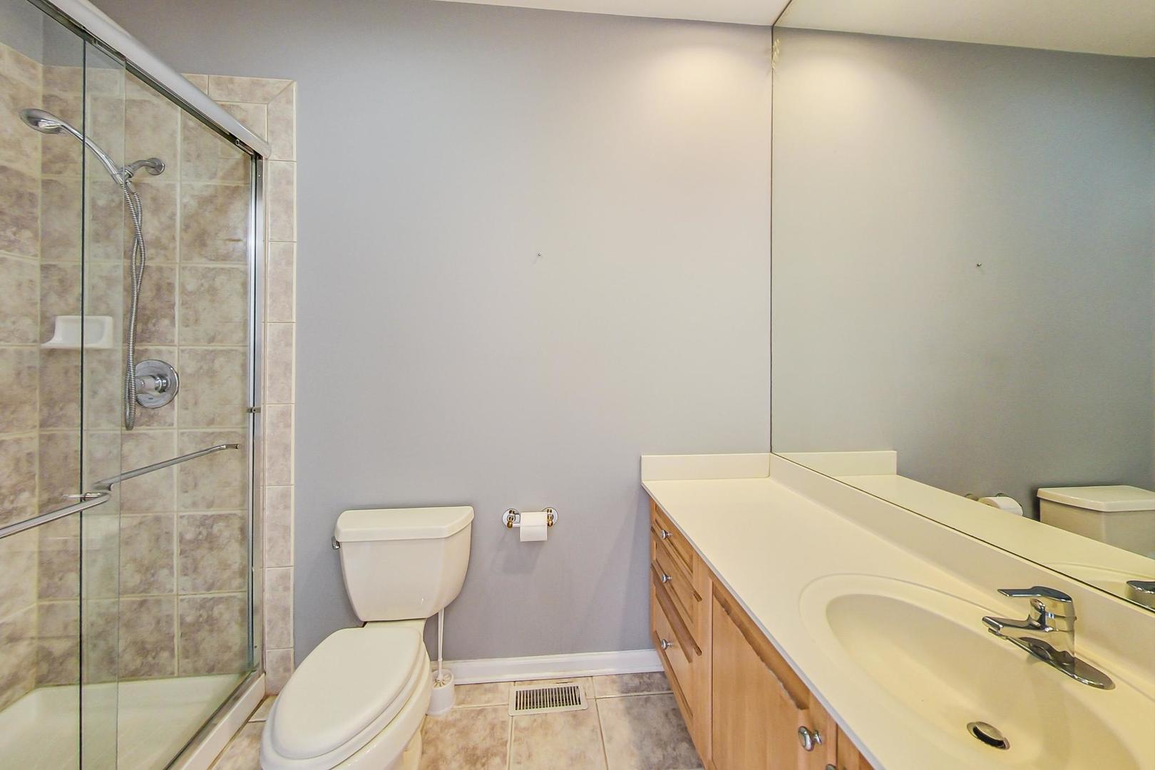 36 Riverside Drive Deerfield, IL 60015 - Photo 34 of 42 a bathroom with a sink a toilet and shower