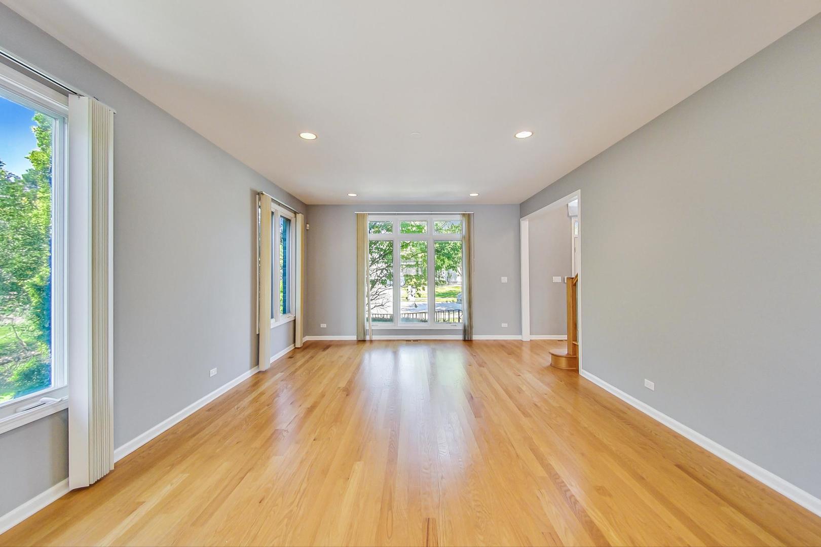 36 Riverside Drive Deerfield, IL 60015 - Photo 5 of 42 a view of an empty room with wooden floor and a window