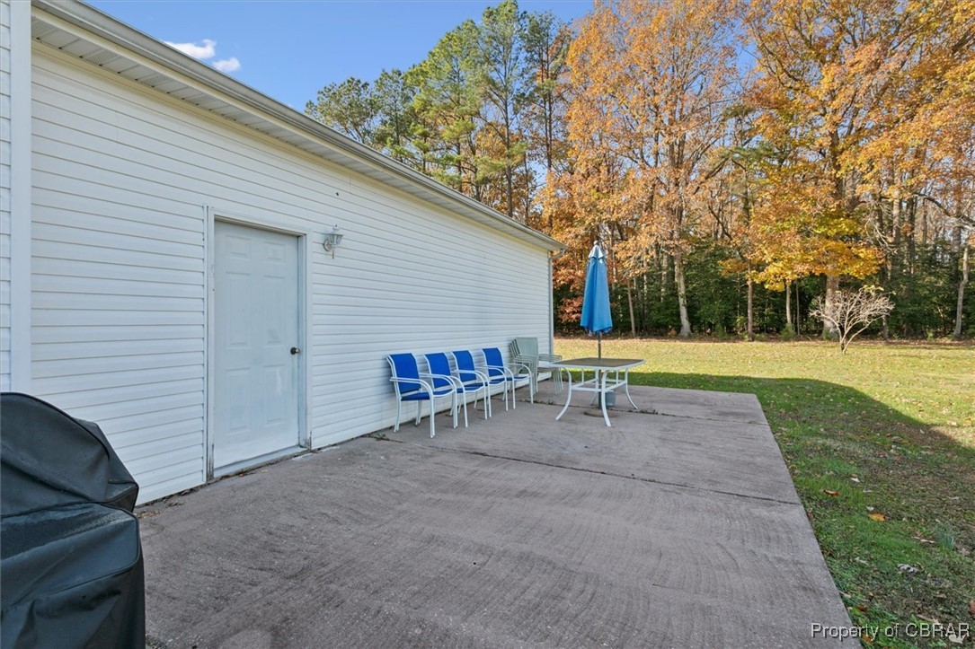 1413 Locust Grove Road Topping, VA 23169 - Photo 37 of 50 View of patio / terrace with a grill
