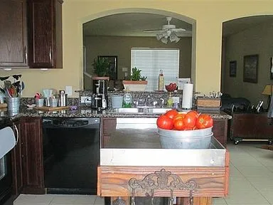 a kitchen with a stove and cabinets
