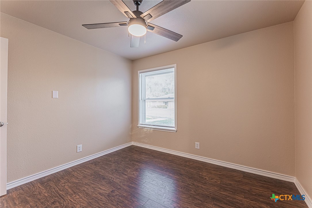 1102 End O Trail Harker Heights, TX 76548 - Photo 20 of 38 an empty room with wooden floor fan and windows