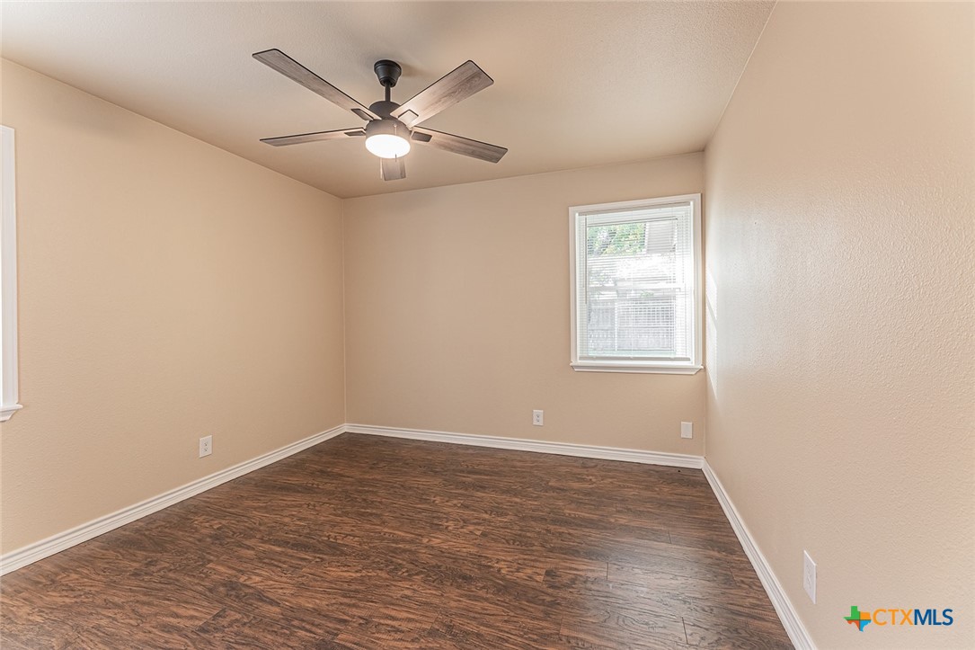1102 End O Trail Harker Heights, TX 76548 - Photo 22 of 38 wooden floor in an empty room with a window