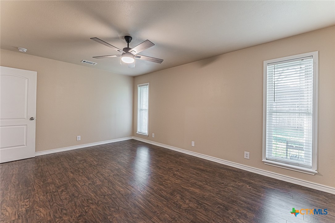 1102 End O Trail Harker Heights, TX 76548 - Photo 26 of 38 a view of an empty room with window and wooden floor
