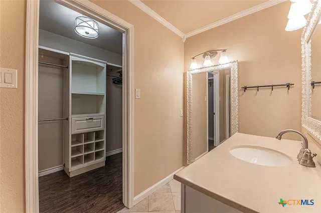 a bathroom with a bath tub with a shower