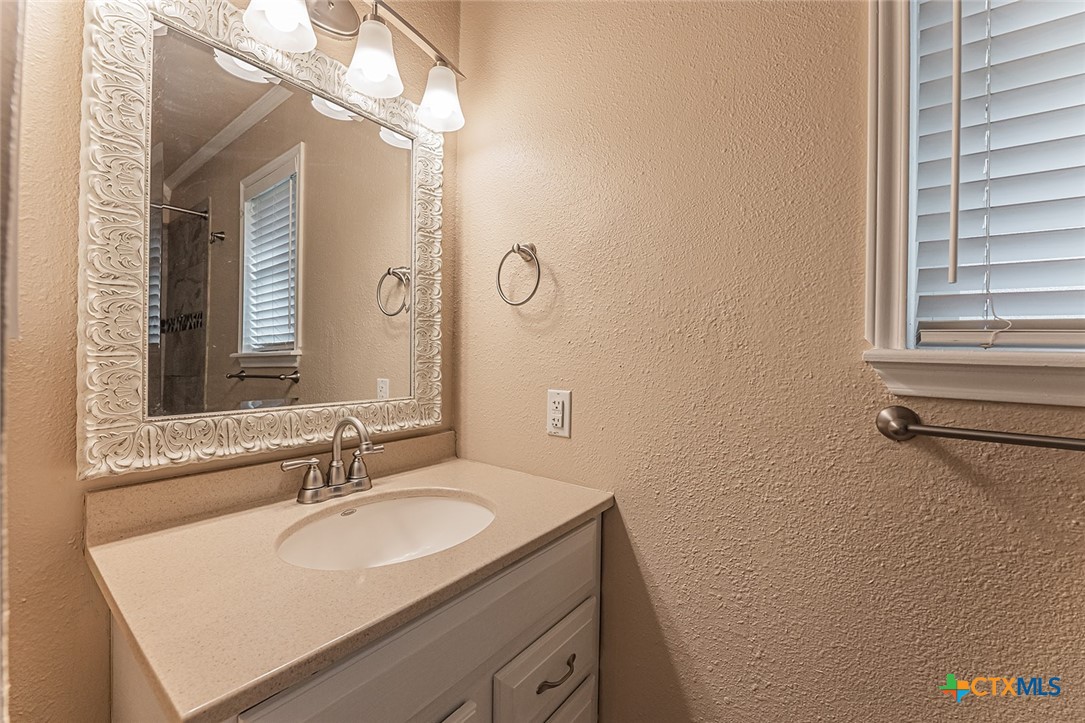 1102 End O Trail Harker Heights, TX 76548 - Photo 30 of 38 a bathroom with a sink and a mirror