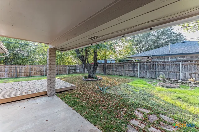 a view of a backyard with a trees