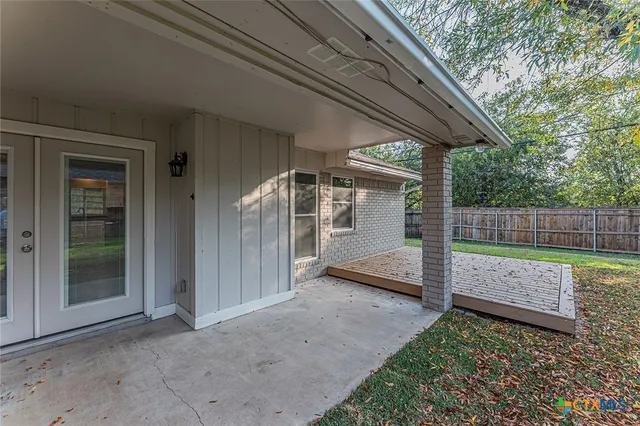 a view of backyard with green space
