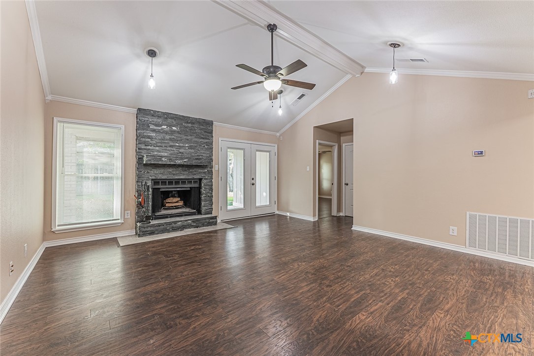 1102 End O Trail Harker Heights, TX 76548 - Photo 4 of 38 an empty room with wooden floor fireplace and windows