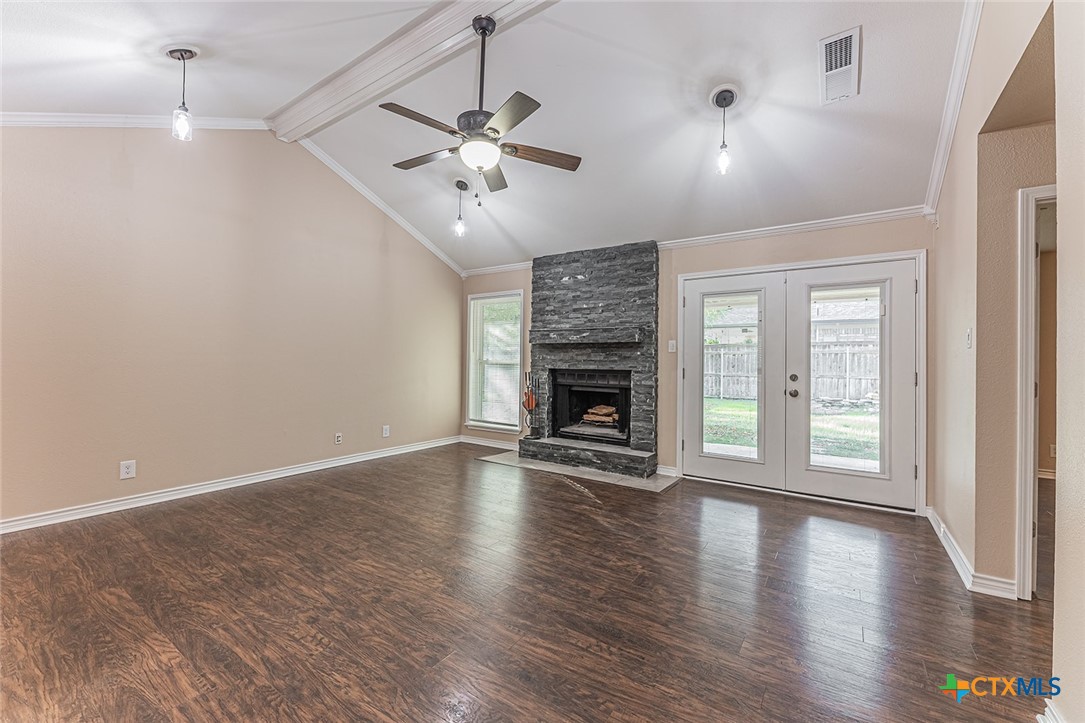 1102 End O Trail Harker Heights, TX 76548 - Photo 6 of 38 an empty room with wooden floor fireplace and windows