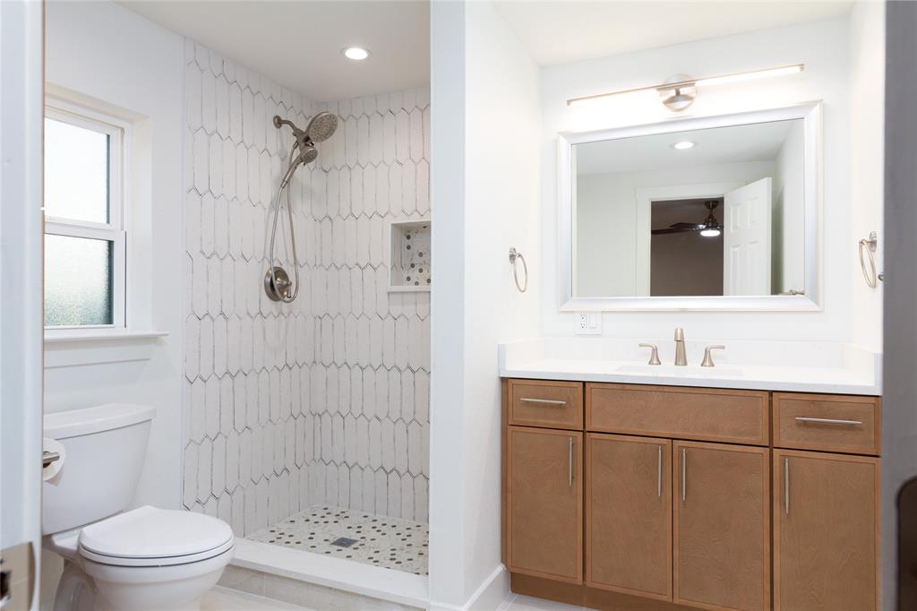 1241 Stevens Ridge Drive Dallas, TX 75211 - Photo 11 of 18 a bathroom with a sink a toilet and shower