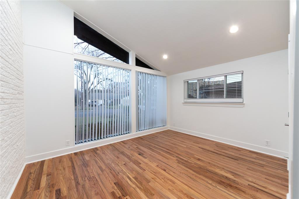 1241 Stevens Ridge Drive Dallas, TX 75211 - Photo 14 of 18 a view of a hallway with wooden floor and a window